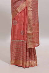 Peach checked floral motifs chiffon saree with self zari border and contrast blouse