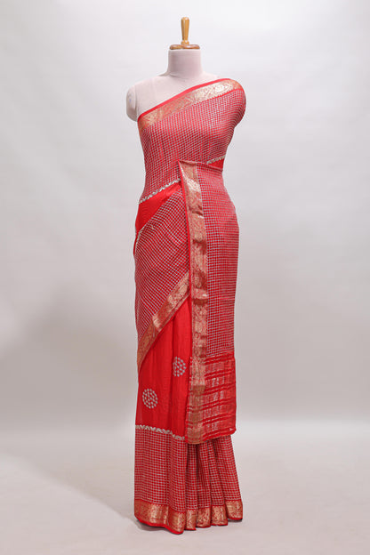 Red checked floral motifs chiffon saree with self zari border and contrast blouse