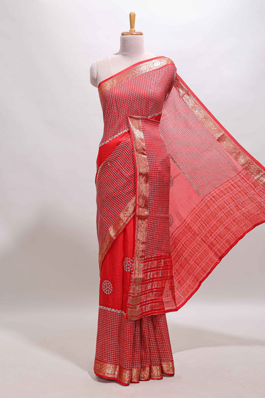 Red checked floral motifs chiffon saree with self zari border and contrast blouse