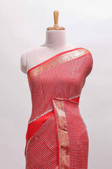 Red checked floral motifs chiffon saree with self zari border and contrast blouse