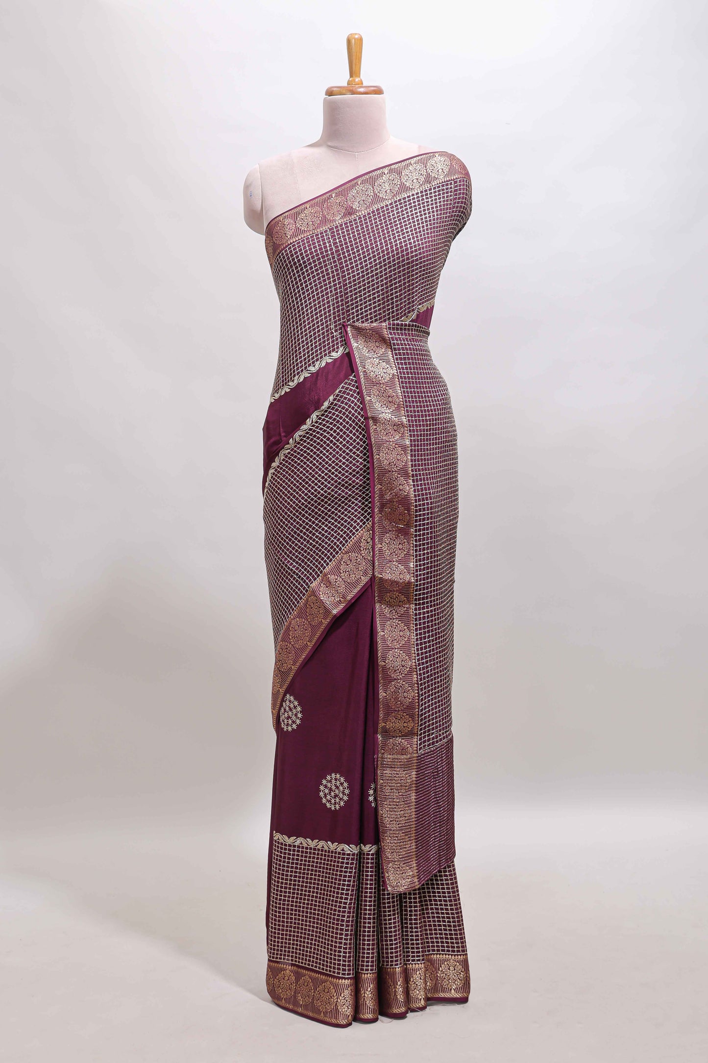 Purple checked floral motifs chiffon saree with self zari border and contrast blouse