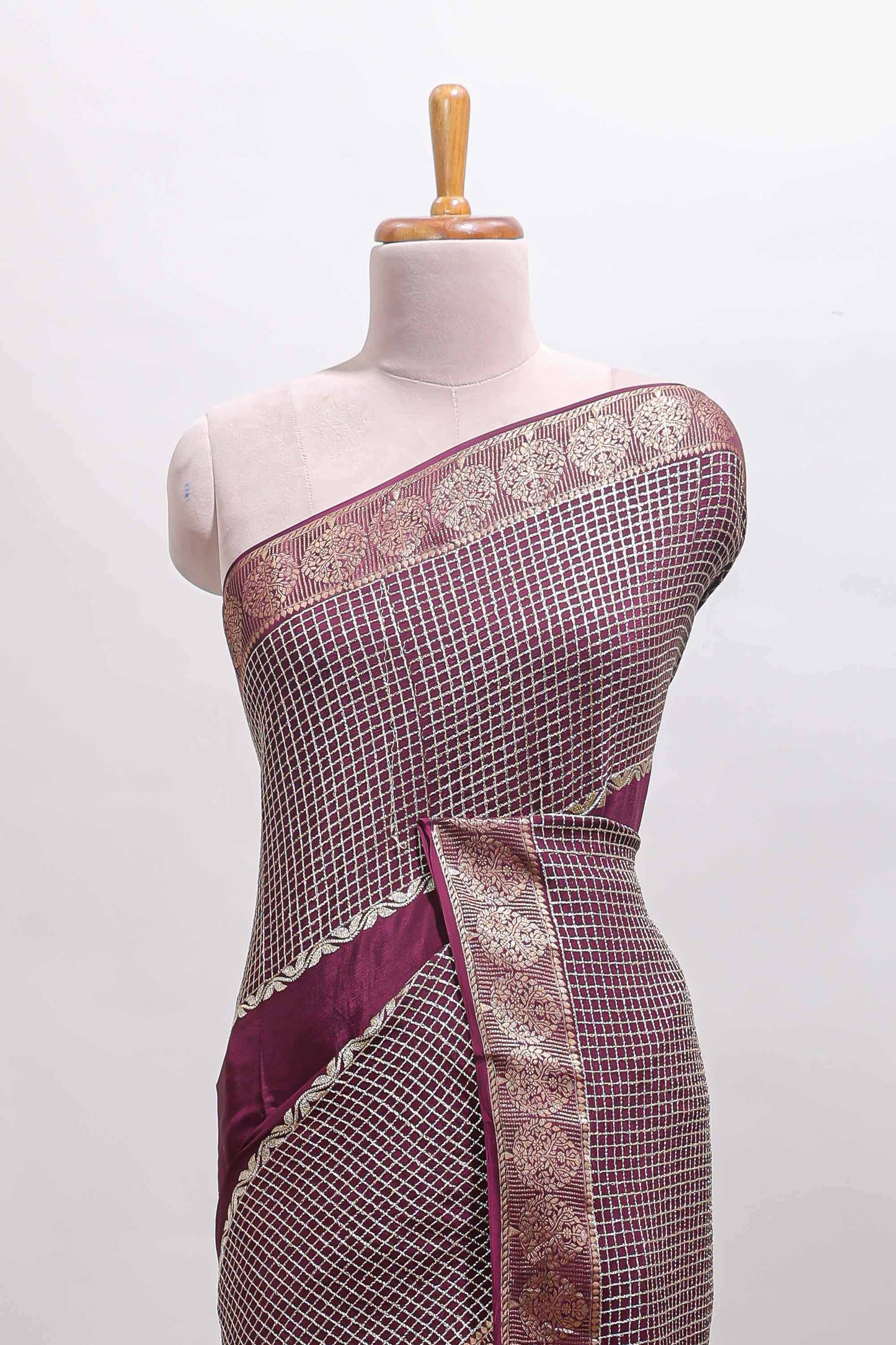 Purple checked floral motifs chiffon saree with self zari border and contrast blouse