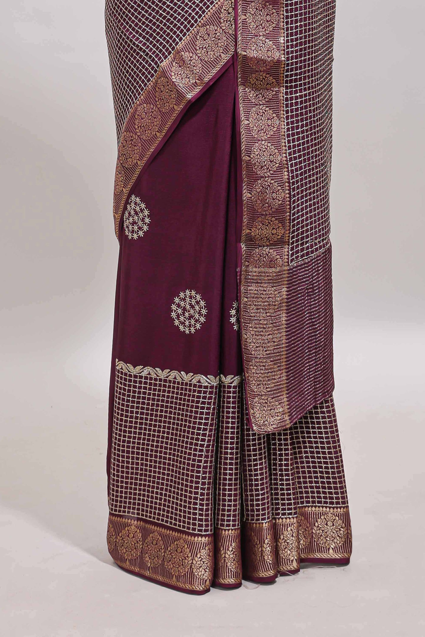 Purple checked floral motifs chiffon saree with self zari border and contrast blouse