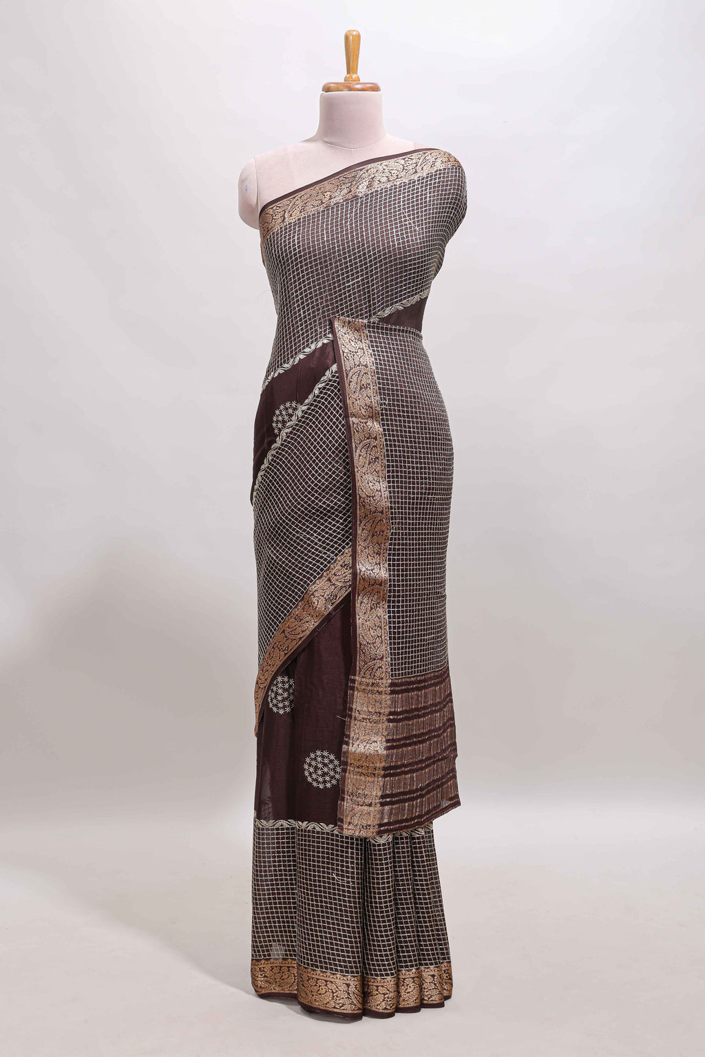 Brown checked floral motifs chiffon saree with self zari border and contrast blouse