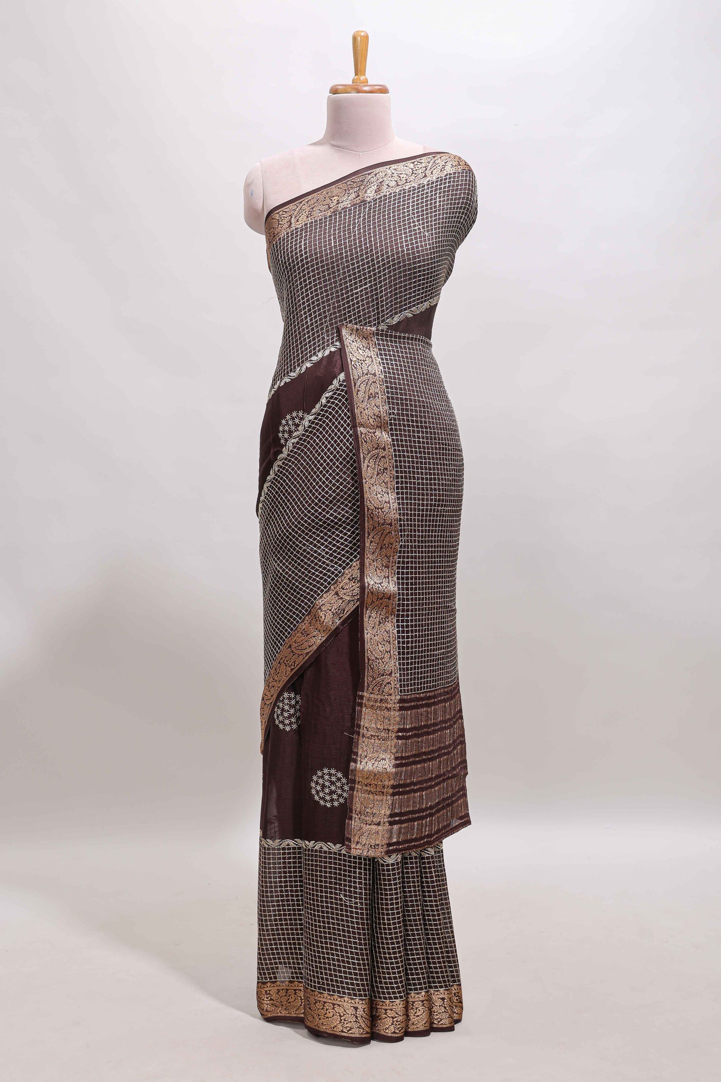 Brown checked floral motifs chiffon saree with self zari border and contrast blouse