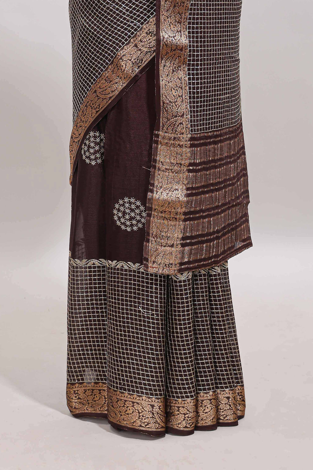 Brown checked floral motifs chiffon saree with self zari border and contrast blouse