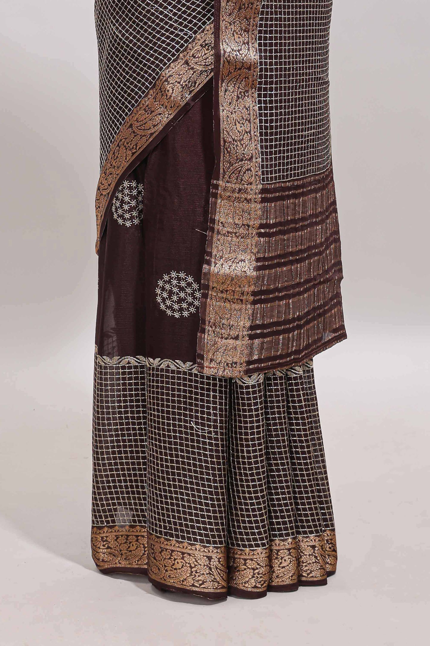 Brown checked floral motifs chiffon saree with self zari border and contrast blouse