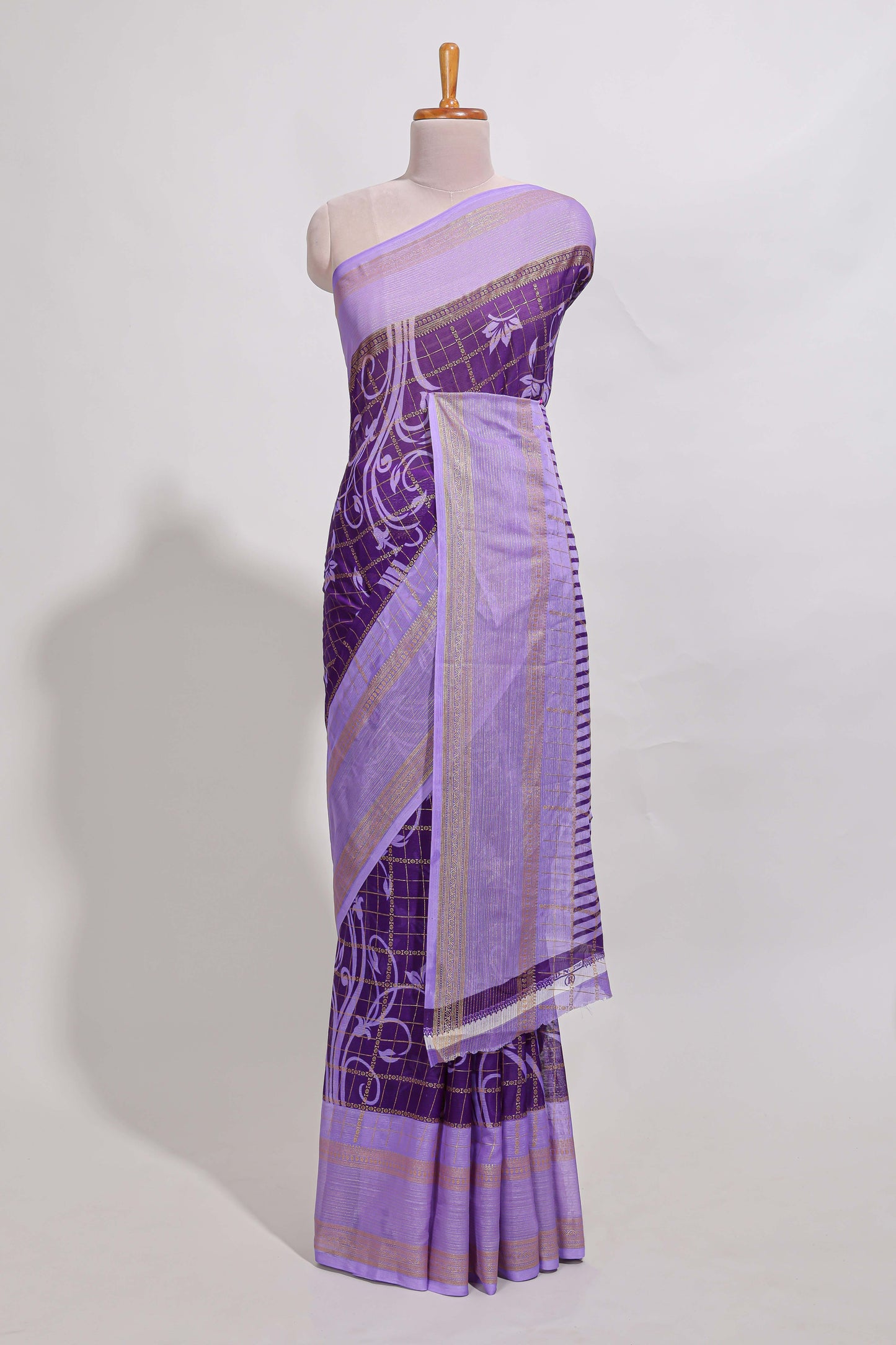 Purple checked floral motifs chiffon saree with self zari border and contrast blouse