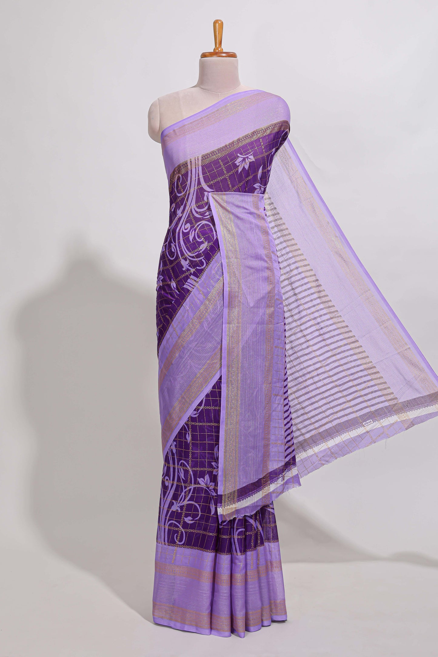 Purple checked floral motifs chiffon saree with self zari border and contrast blouse