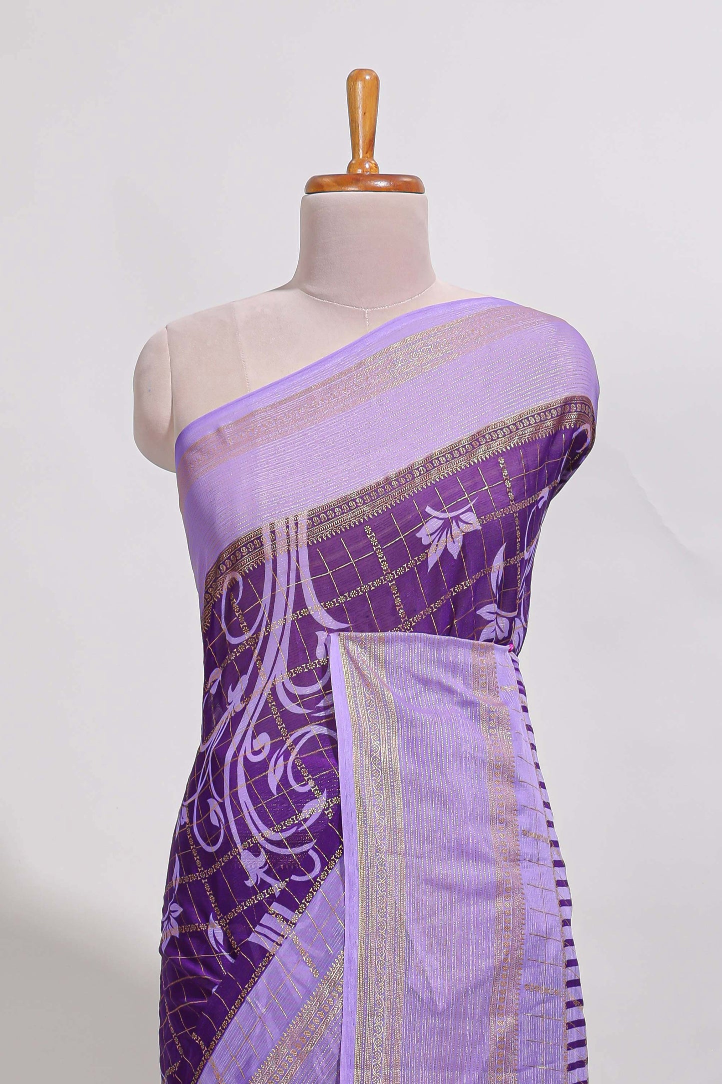 Purple checked floral motifs chiffon saree with self zari border and contrast blouse