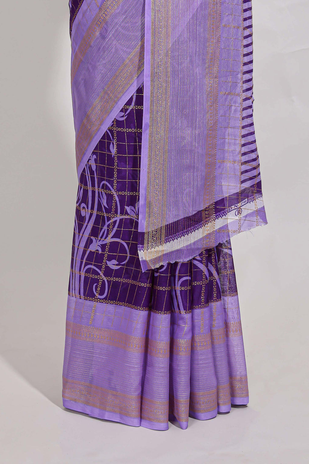 Purple checked floral motifs chiffon saree with self zari border and contrast pallu and blouse