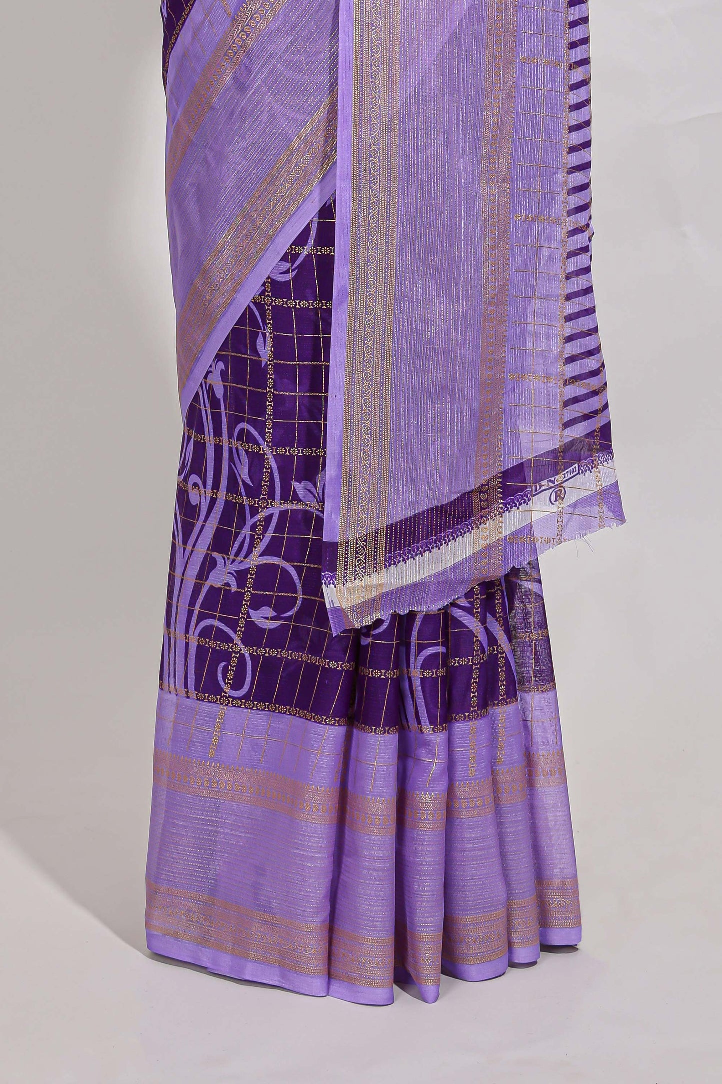 Purple checked floral motifs chiffon saree with self zari border and contrast blouse