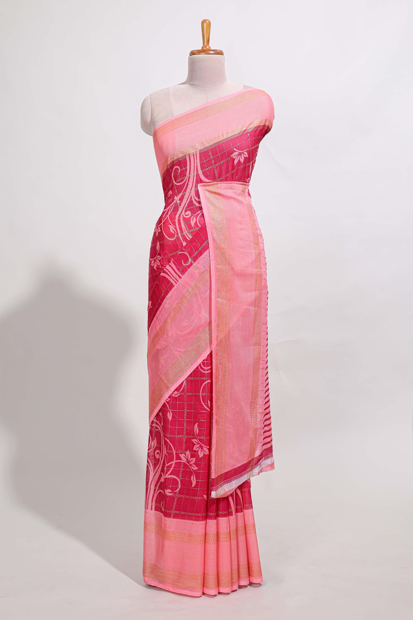Rani pink checked floral motifs chiffon saree with self zari border and contrast blouse