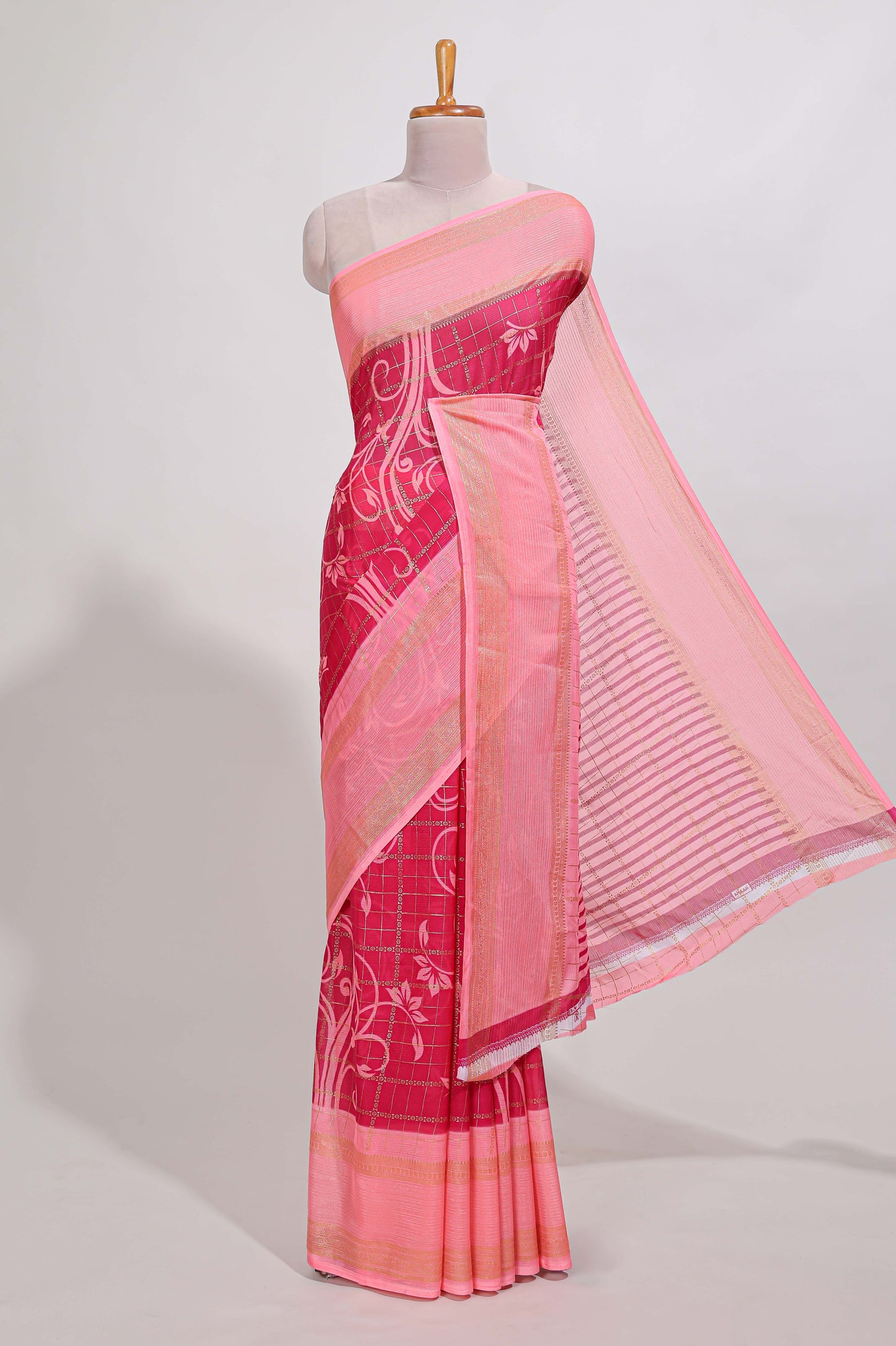 Rani pink checked floral motifs chiffon saree with self zari border and contrast blouse