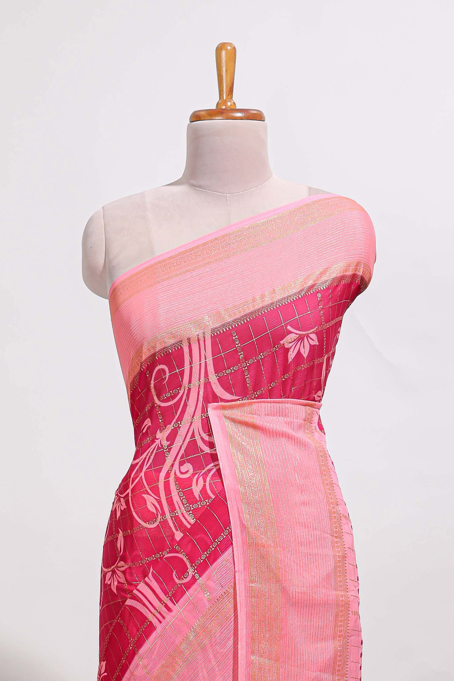 Rani pink checked floral motifs chiffon saree with self zari border and contrast blouse