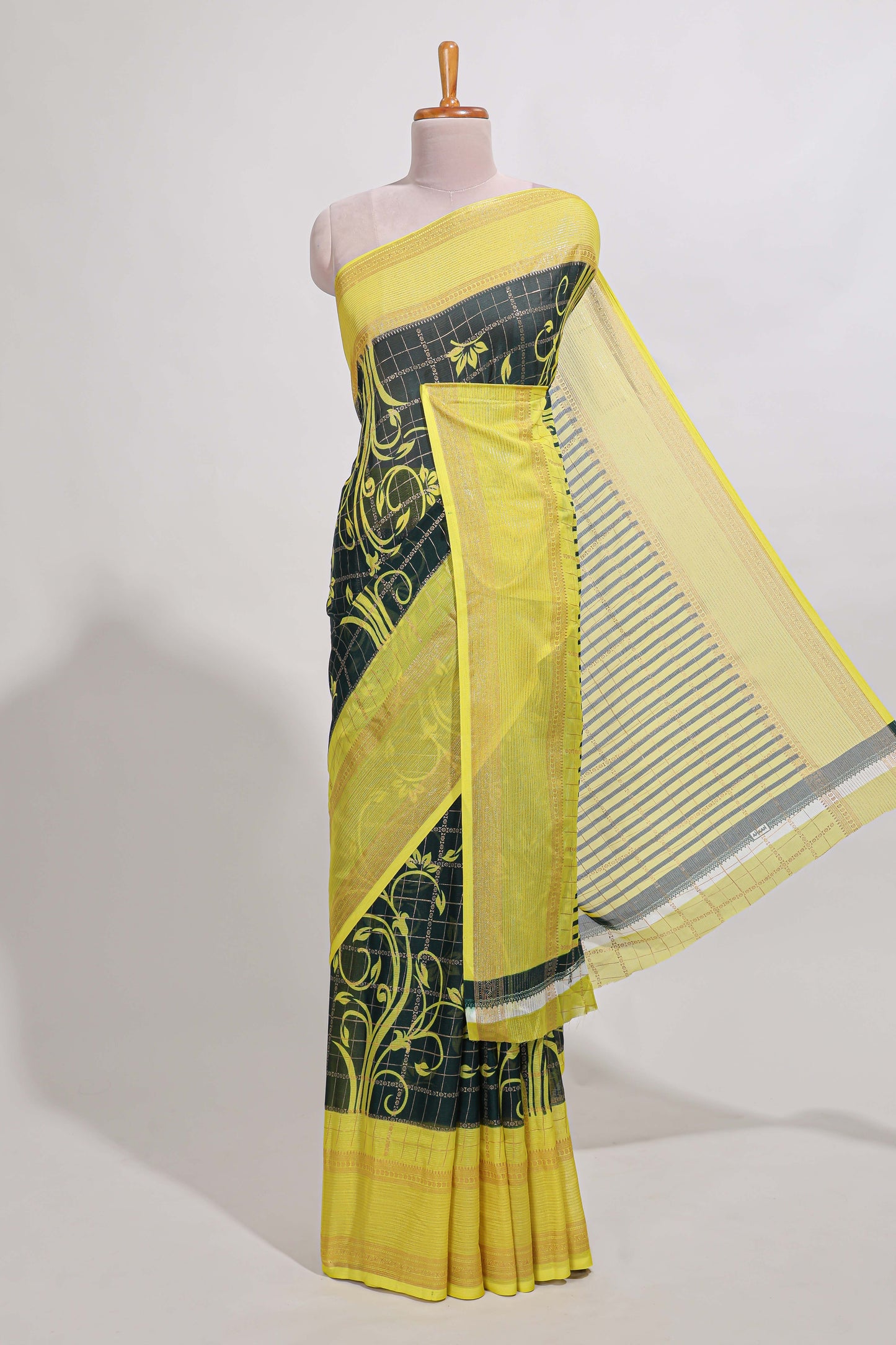 Green checked floral motifs chiffon saree with self zari border and contrast blouse