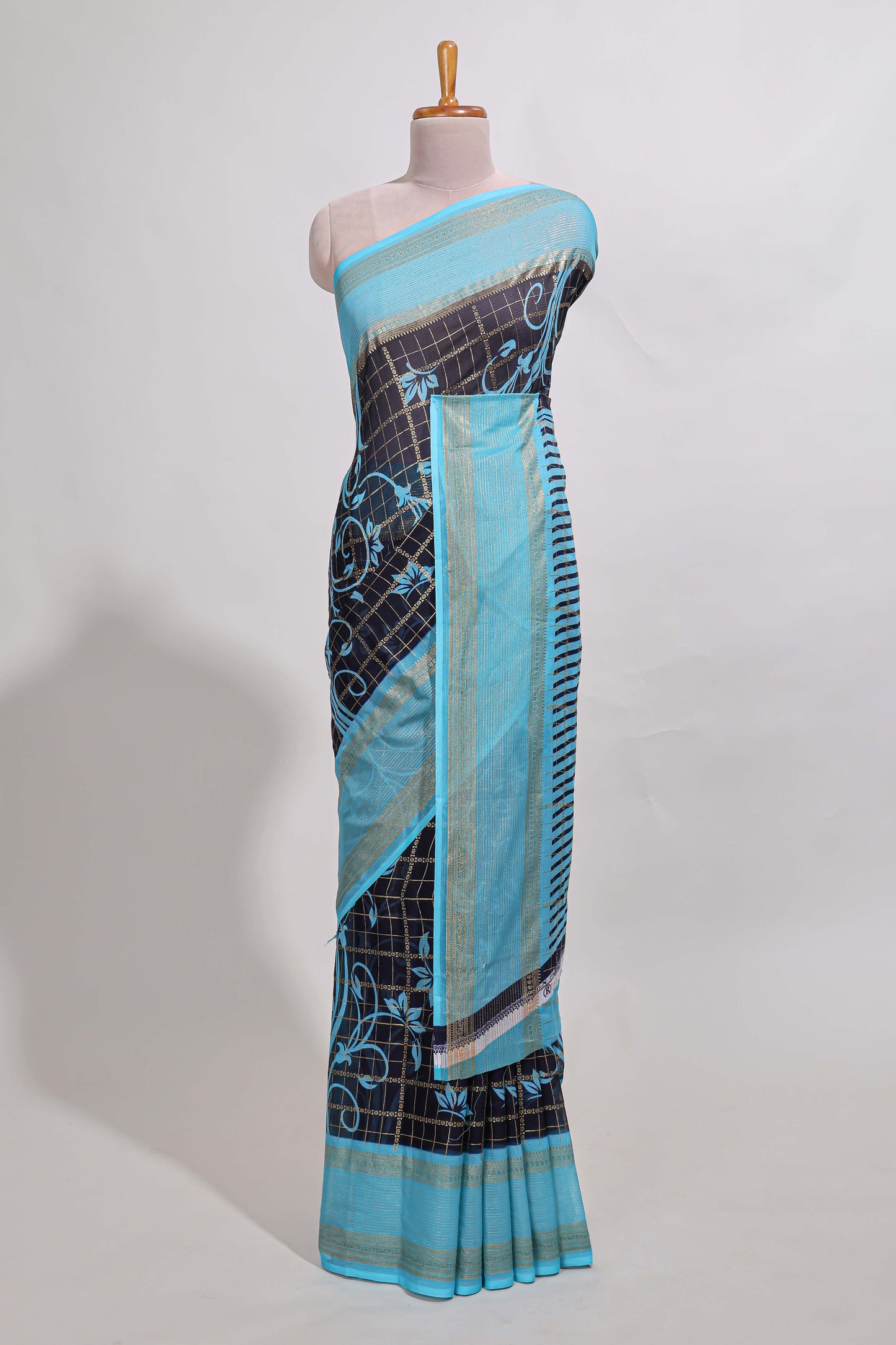 Navy blue checked floral motifs chiffon saree with self zari border and contrast blouse