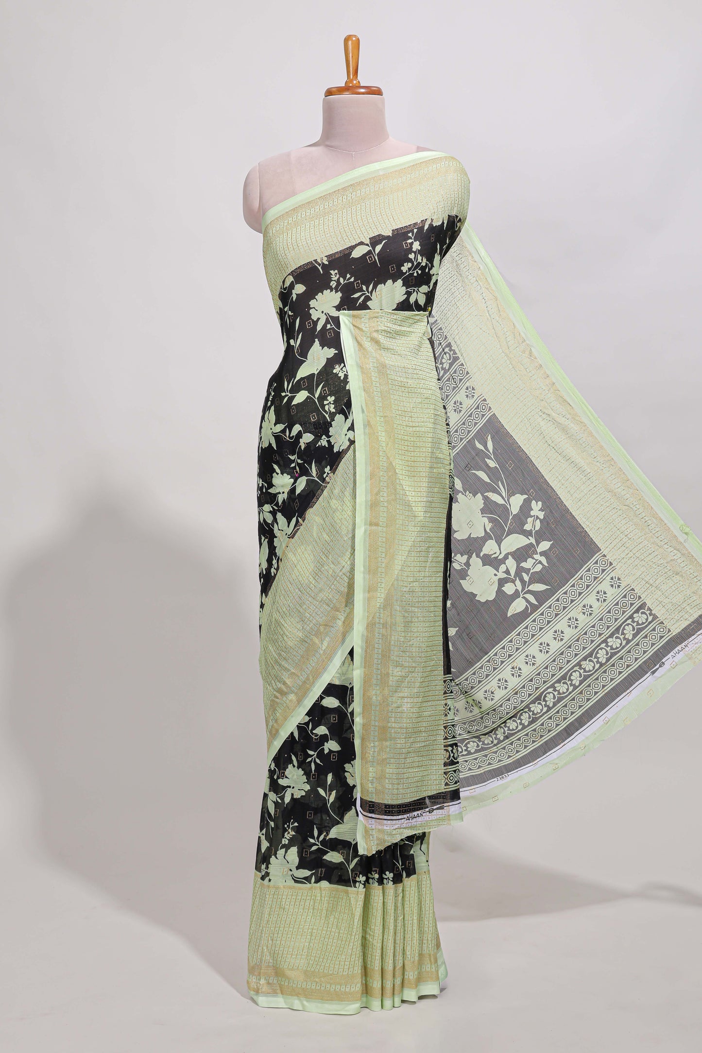 Black checked floral motifs chiffon saree with self zari border and contrast blouse