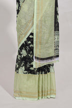 Black and green checked floral motifs chiffon saree with self zari border and contrast blouse