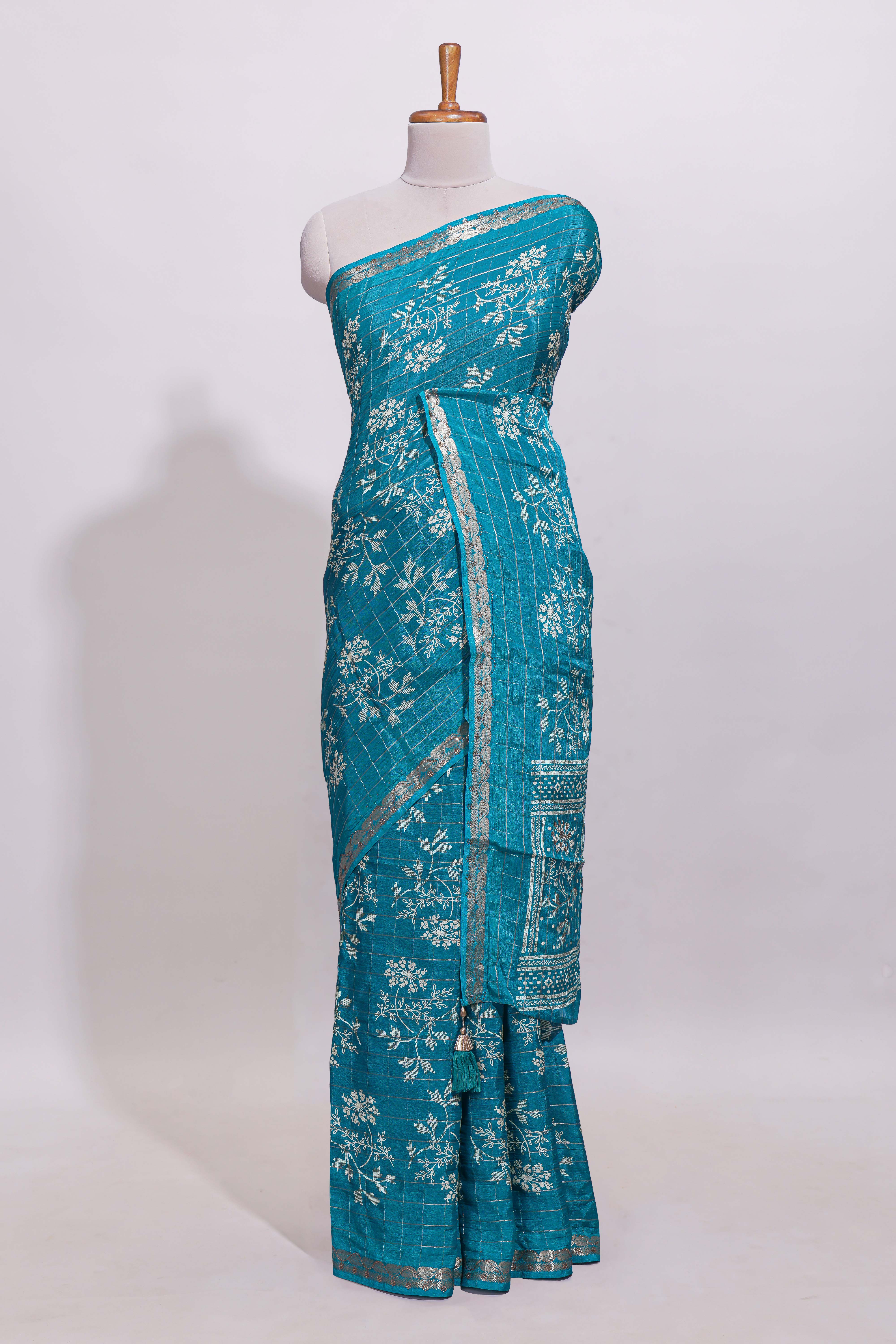 Teal blue checked with floral motifs chiffon saree with self zari border and matching blouse