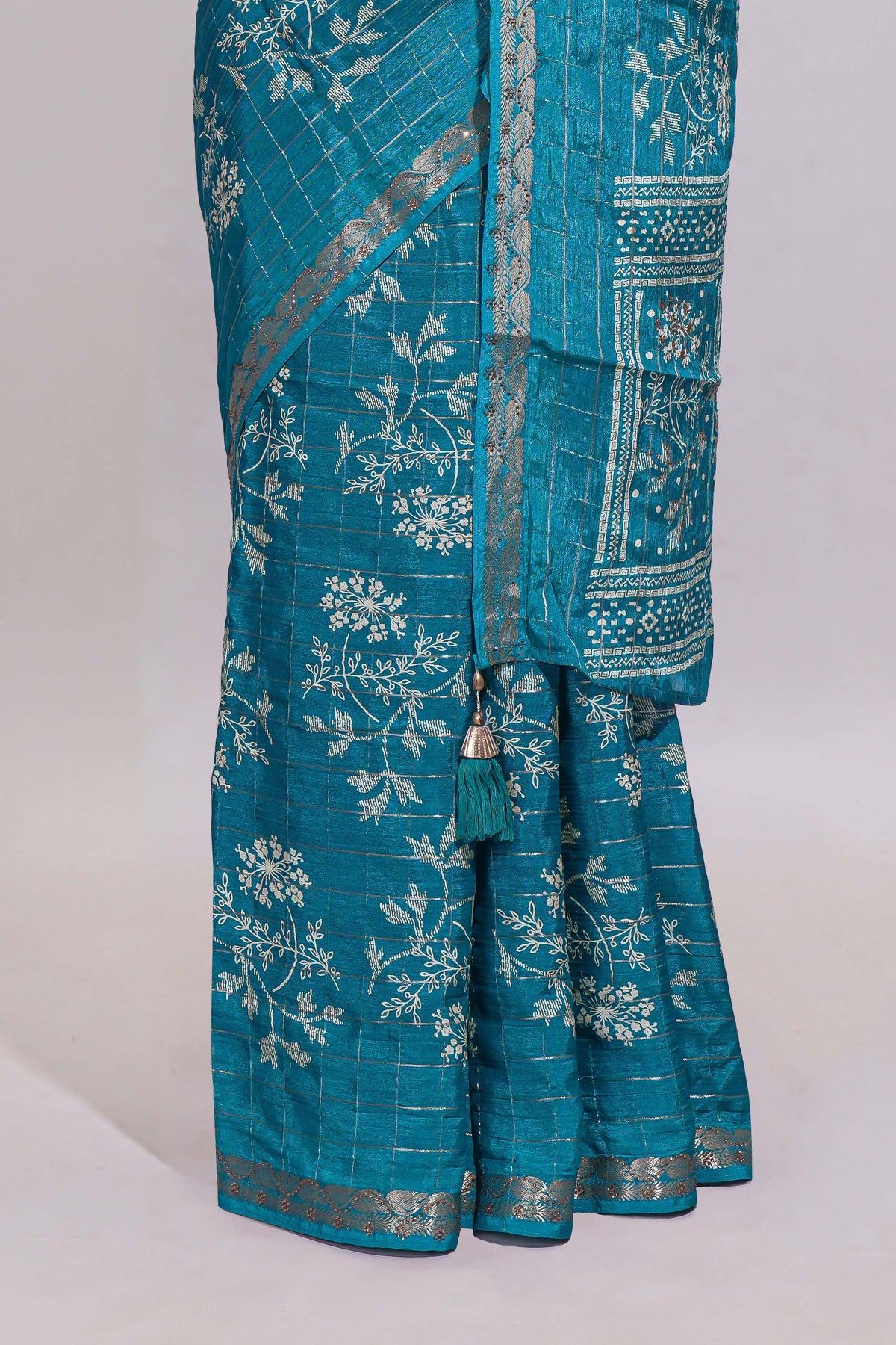 Teal blue checked with floral motifs chiffon saree with self zari border and matching blouse