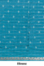 Teal blue checked with floral motifs chiffon saree with self zari border and matching blouse