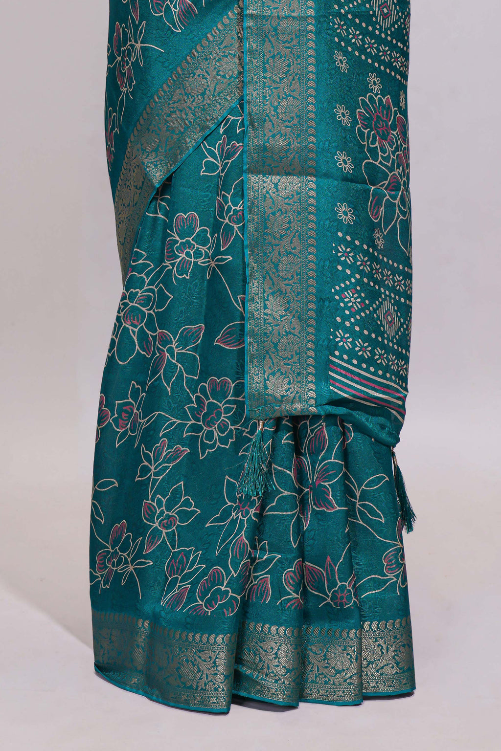 Teal green floral designed chiffon saree with self zari border and matching blouse