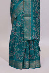 Teal green floral designed chiffon saree with self zari border and matching blouse