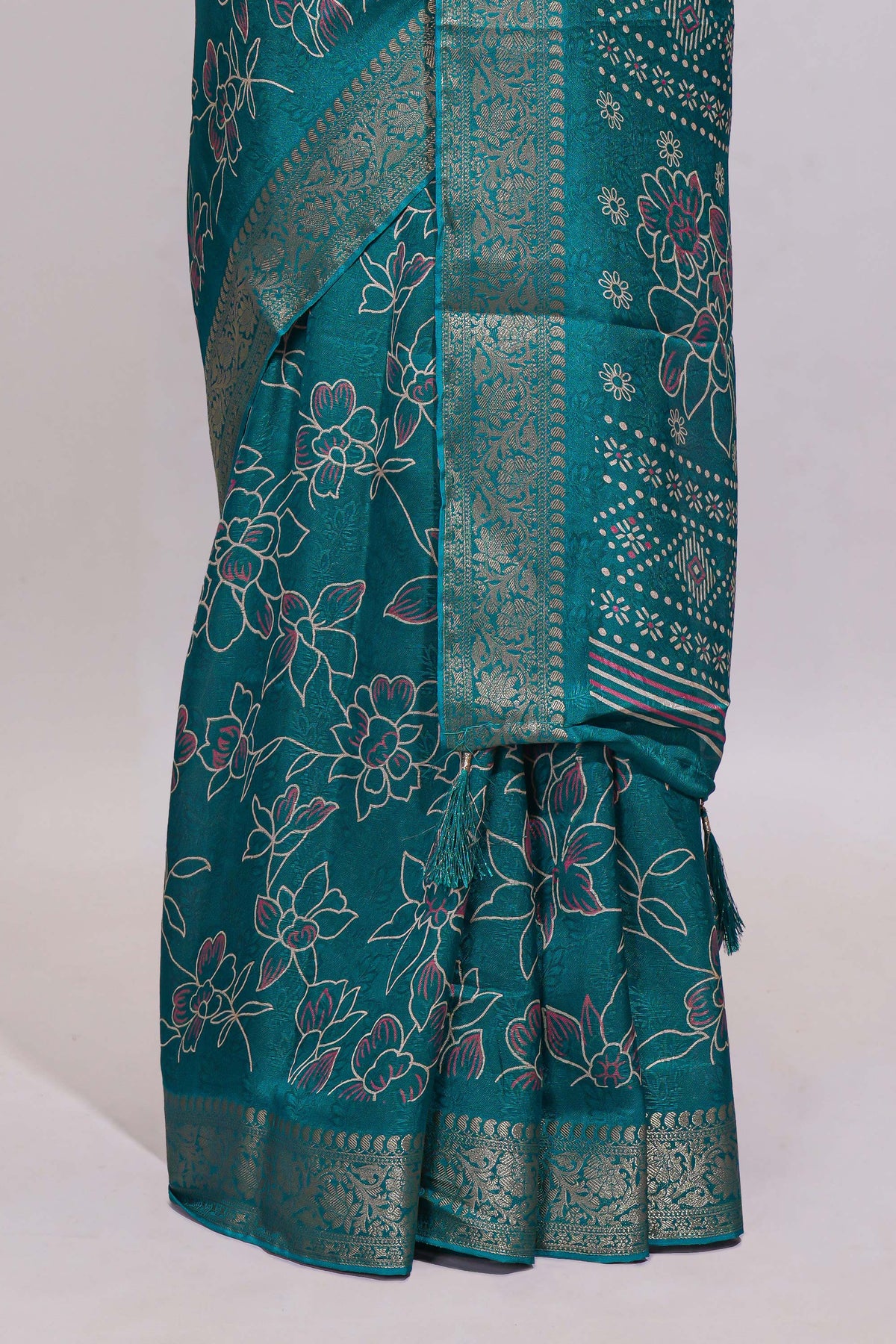 Teal green floral designed chiffon saree with self zari border and matching blouse