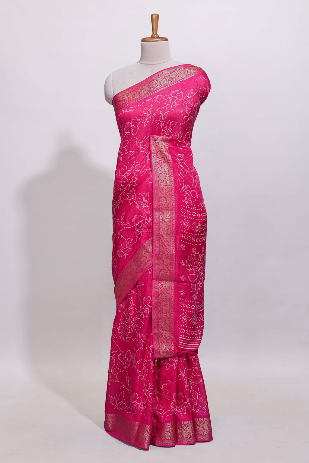 Pink floral designed chiffon saree with self zari border and matching blouse