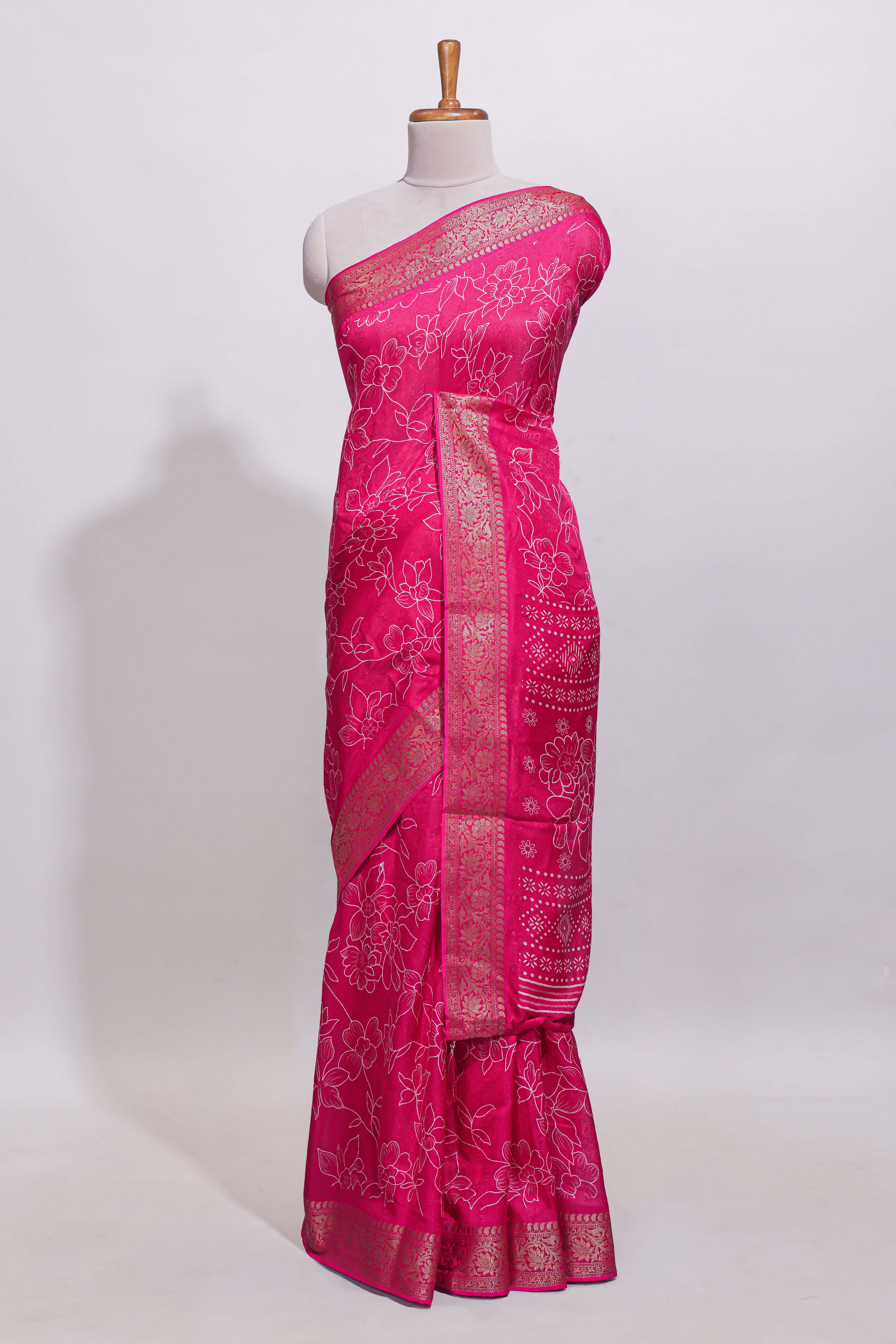 Pink floral designed chiffon saree with self zari border and matching blouse