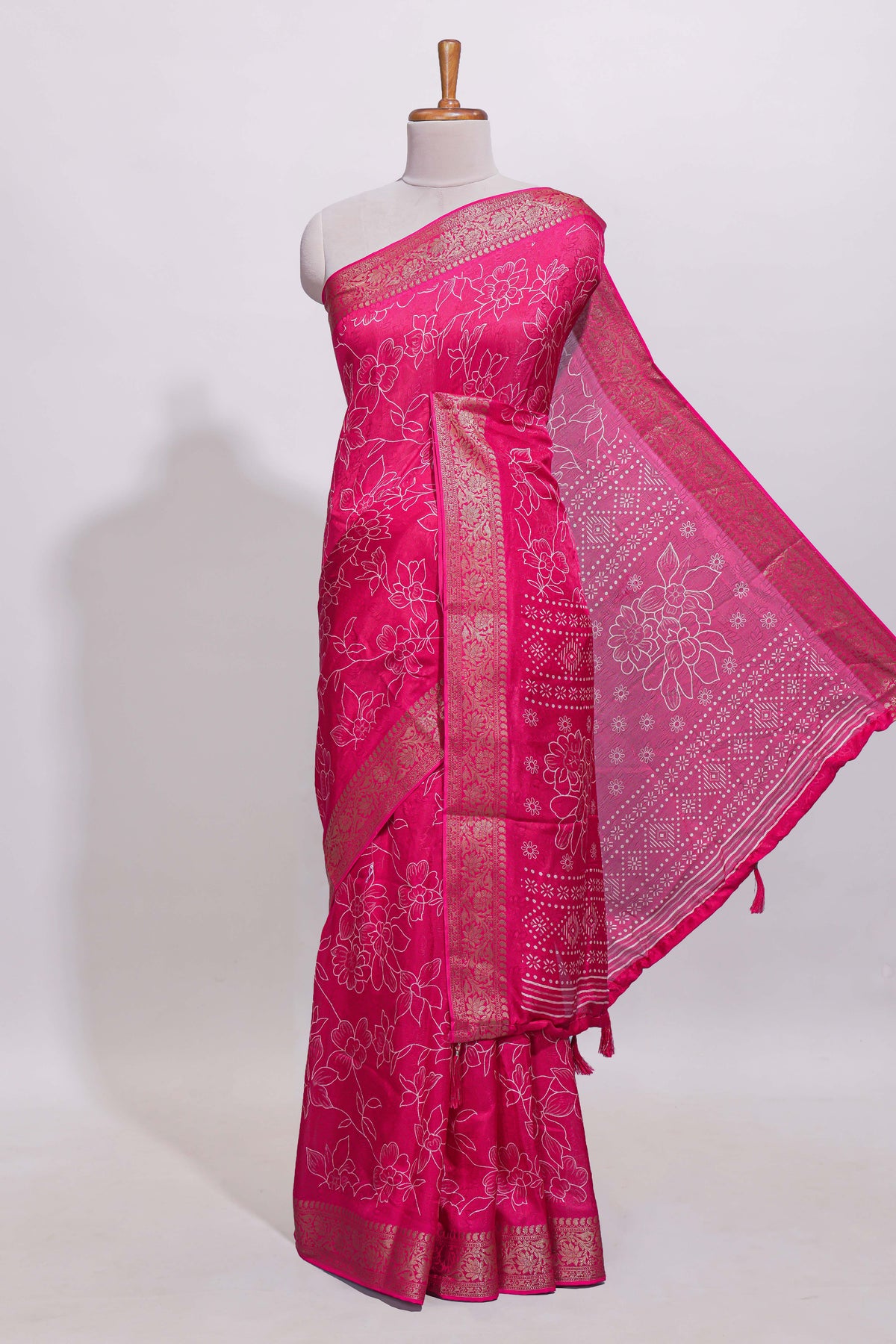Pink floral designed chiffon saree with self zari border and matching blouse