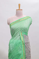 Green bhandhini style floral design chanderi cotton saree with self zari border and contrast printed blouse