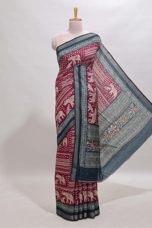 Maroon geometric & elephant motif chanderi cotton saree with contrast border and chevron blouse