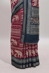 Maroon geometric & elephant motif chanderi cotton saree with contrast border and chevron blouse