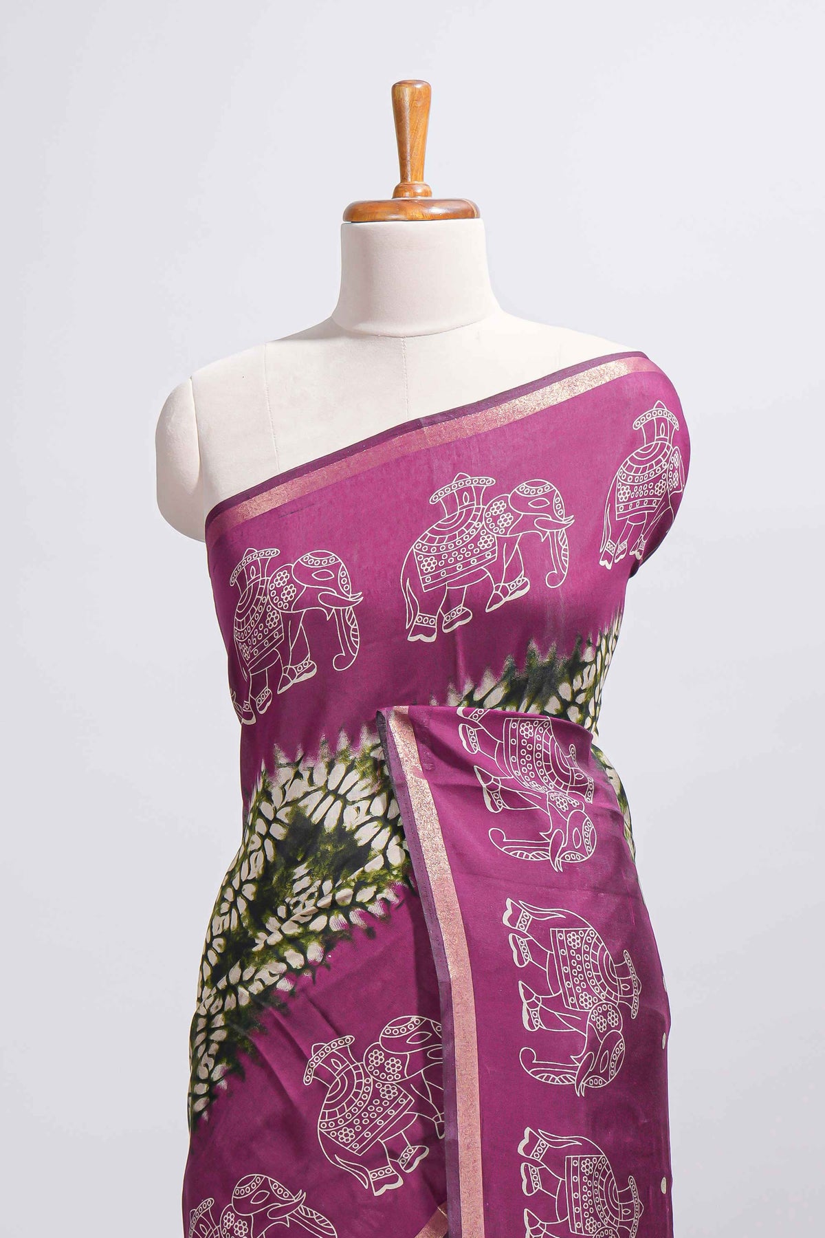 Dark green Chanderi cotton saree with elephant motifs tie and dye effect patterns and contrast zari border along with printed blouse