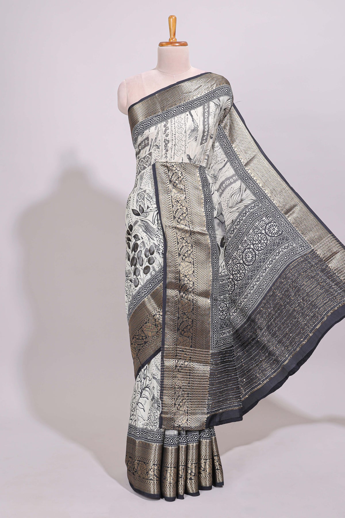 Cream floral design Chanderi cotton saree with contrast zari border and zari motifs blouse