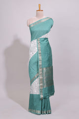 White floral design Chanderi cotton saree with contrast turquoise green zari border and floral print blouse