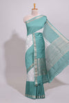 White floral design Chanderi cotton saree with contrast turquoise green zari border and floral print blouse