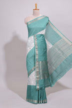 White floral design Chanderi cotton saree with contrast turquoise green zari border and floral print blouse