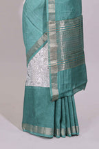 White floral design Chanderi cotton saree with contrast turquoise green zari border and floral print blouse