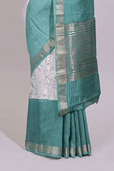 White floral design Chanderi cotton saree with contrast turquoise green zari border and floral print blouse