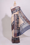 Cream geometric checked motifs chanderi cotton saree with contrast zari border and printed blouse