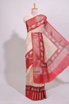 Cream geometric checked motifs chanderi cotton saree with contrast red border and printed blouse