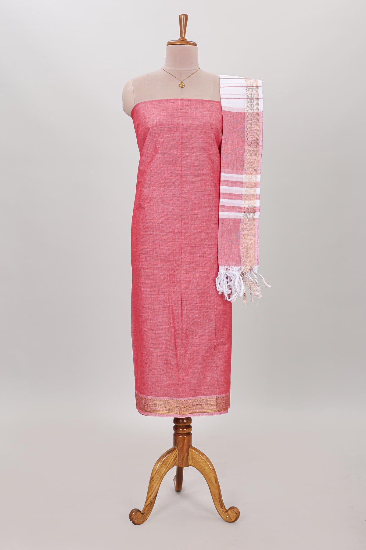 Peach plain cotton chudidhar material with contrast solid pant and matching striped dupatta