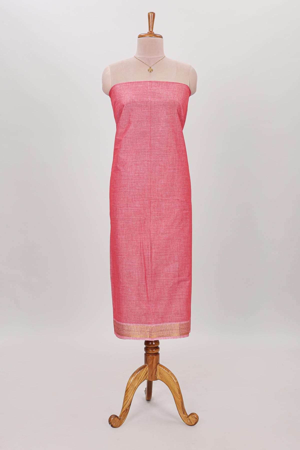 Peach plain cotton chudidhar material with contrast solid pant and matching striped dupatta