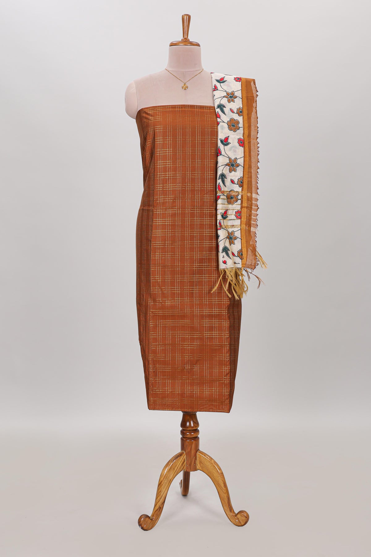 Orange checked cotton chudidhar material with matching solid pant and contrast floral dupatta