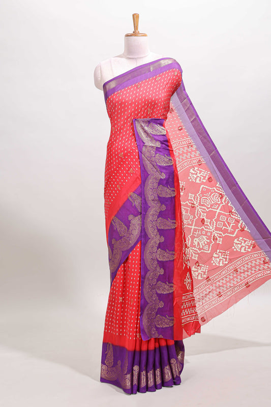 Red floral design zari butta dola silk saree with contrast floral zari design border and ikkat style pallu