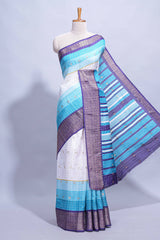 White and Aqua Blue Dola Silk Saree with rich zari border woven butis and a designer pallu along with contrast blouse