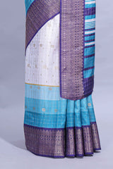 White and Aqua Blue Dola Silk Saree with rich zari border woven butis and a designer pallu along with contrast blouse